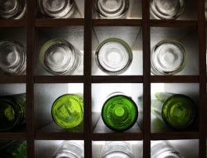 assorted glass bottle with wooden rack thumbnail