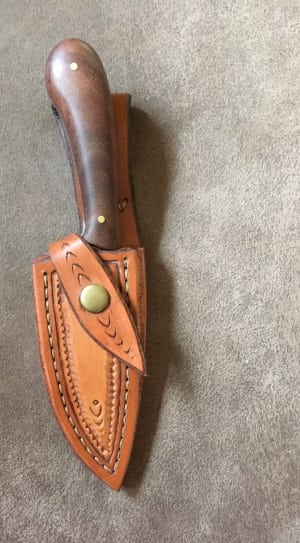 brown handled knife with brown leather sheath thumbnail