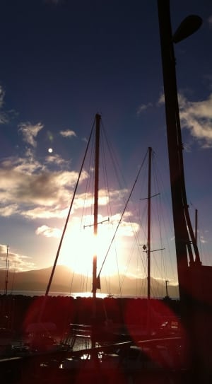 silhouette photograph of sailing boat during sunset thumbnail