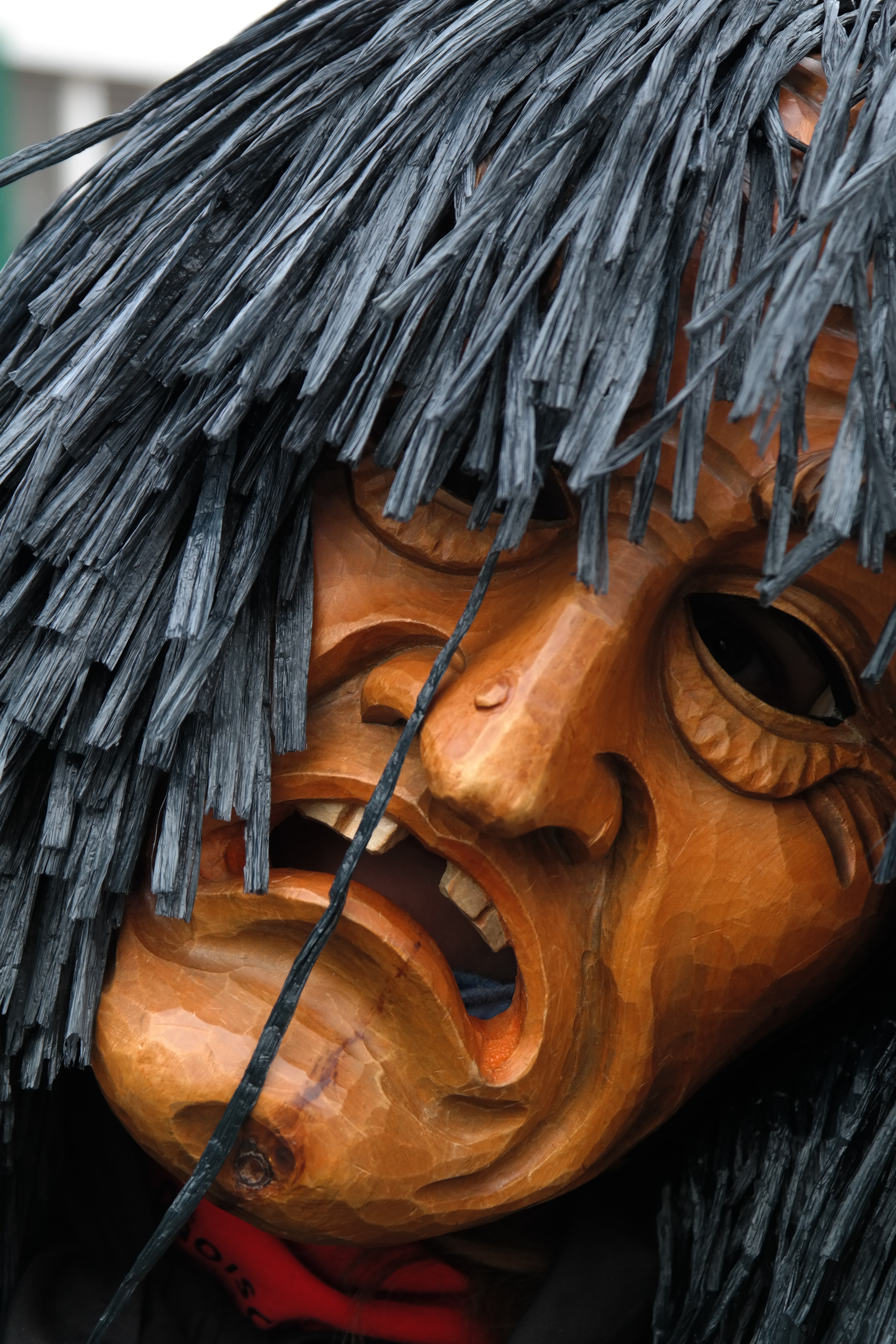 brown wooden and gray mask