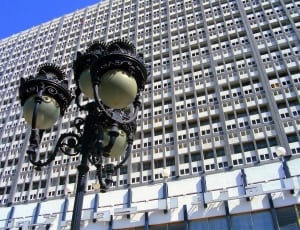 brown metal street lamp and white high rise building thumbnail