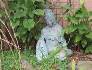 blue and gray ceramic buddha statue thumbnail