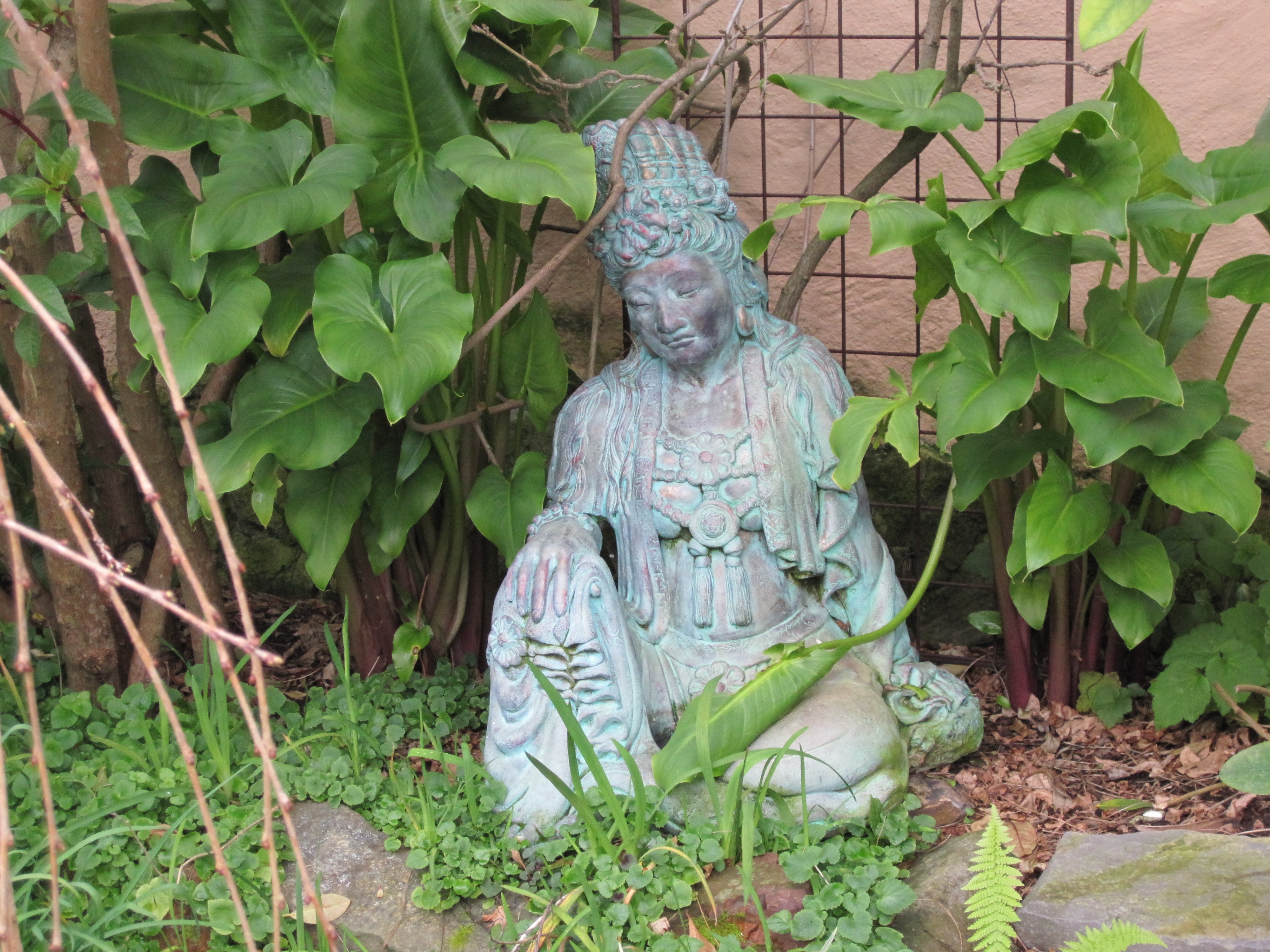 blue and gray ceramic buddha statue