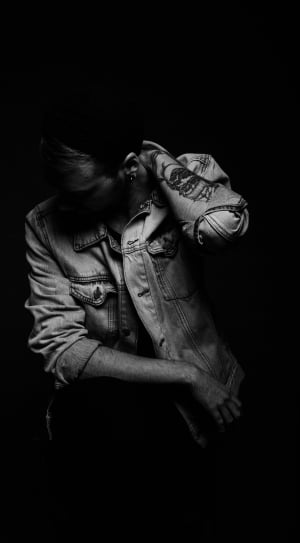 grayscale picture of man wearing denim jacket thumbnail