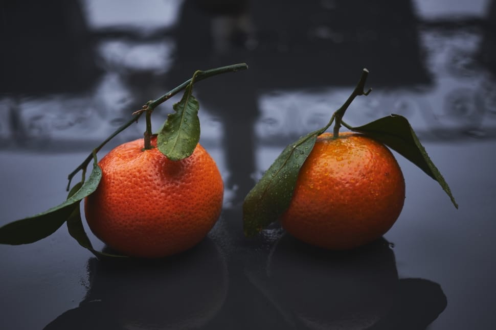 tilt shift lens photography of two oranges preview