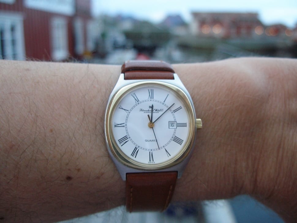 white and gold round analog watch preview