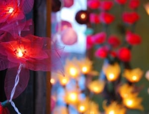 red artificial poinsettias string lights thumbnail