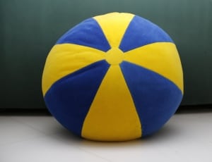 blue and yellow round fabric throw pillow thumbnail
