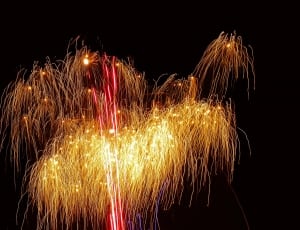 yellow fireworks with black background thumbnail