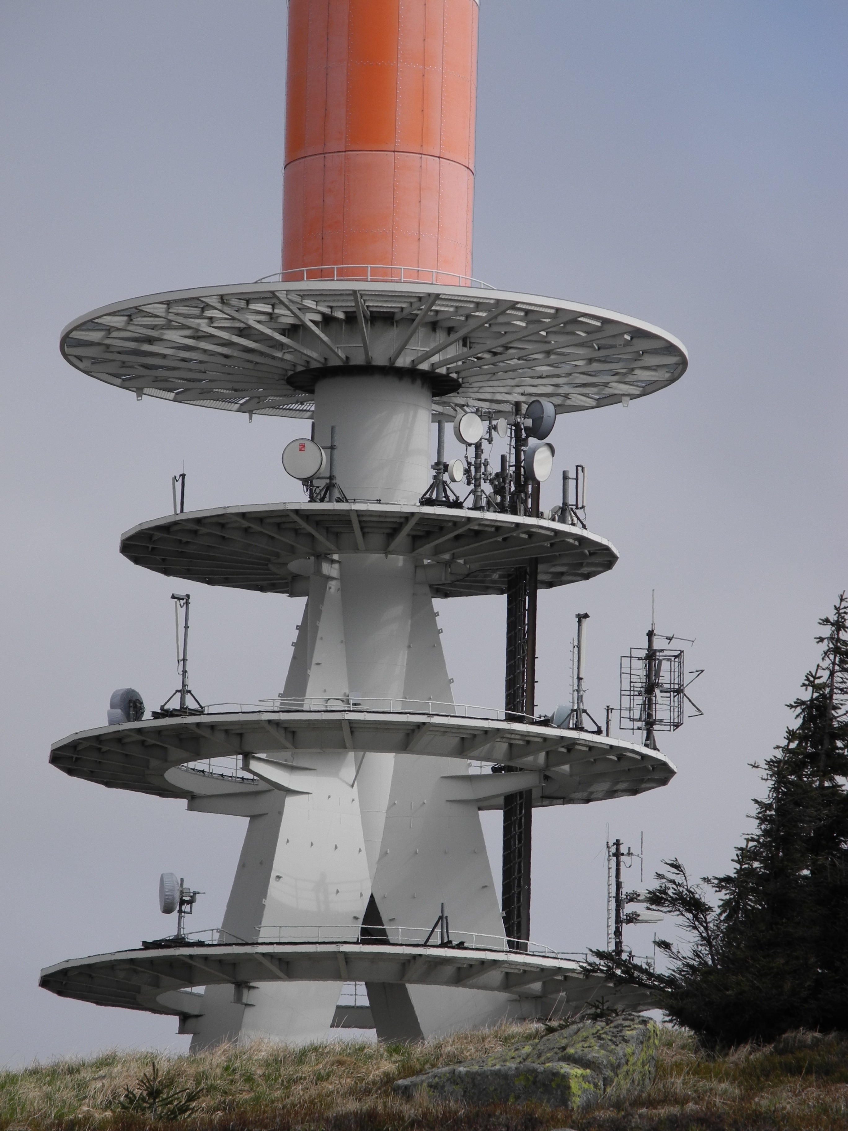 grey and orange satellite tower