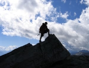 silhouette photo of man in top of mountain thumbnail