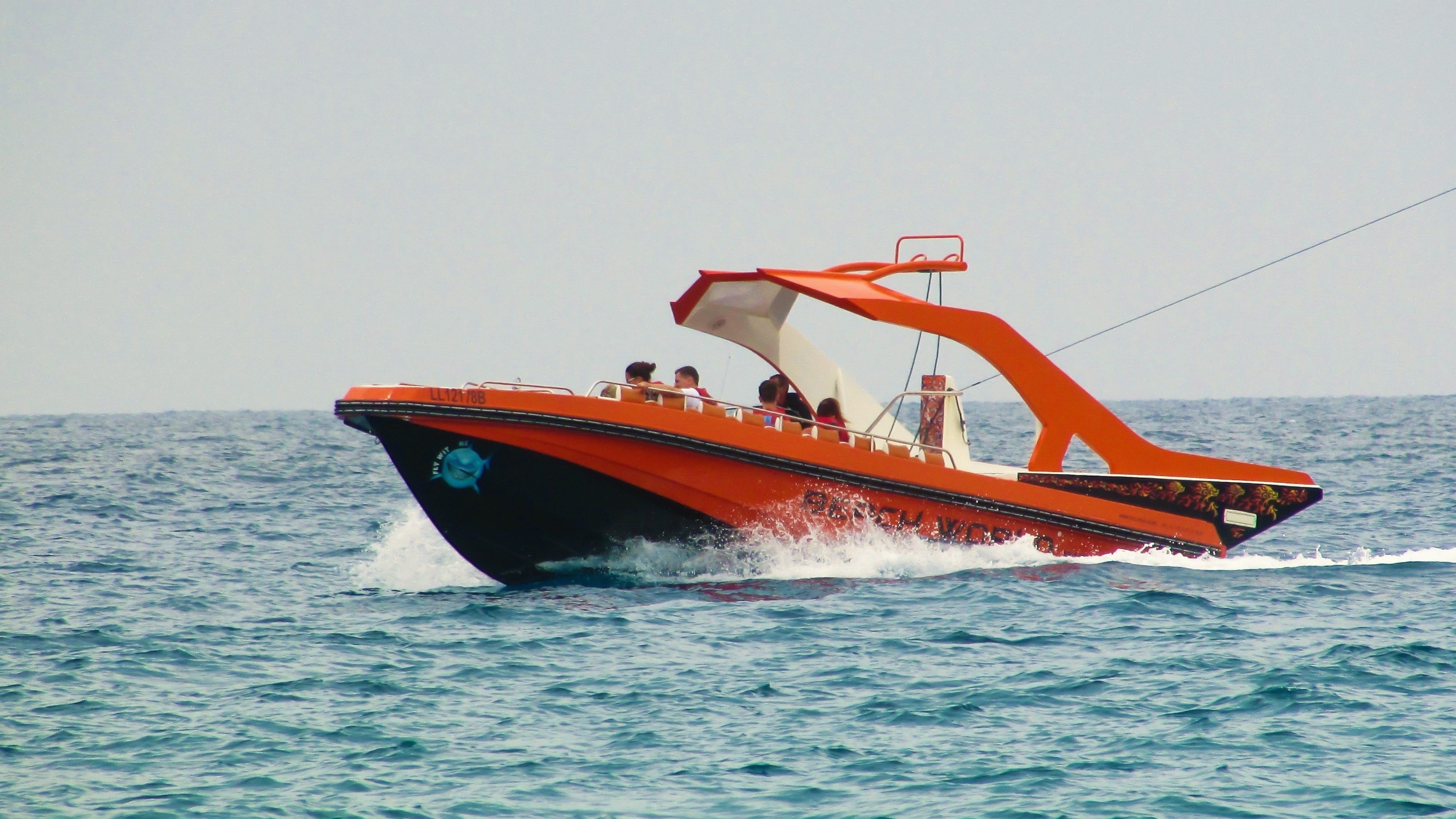 orange and black speedboat