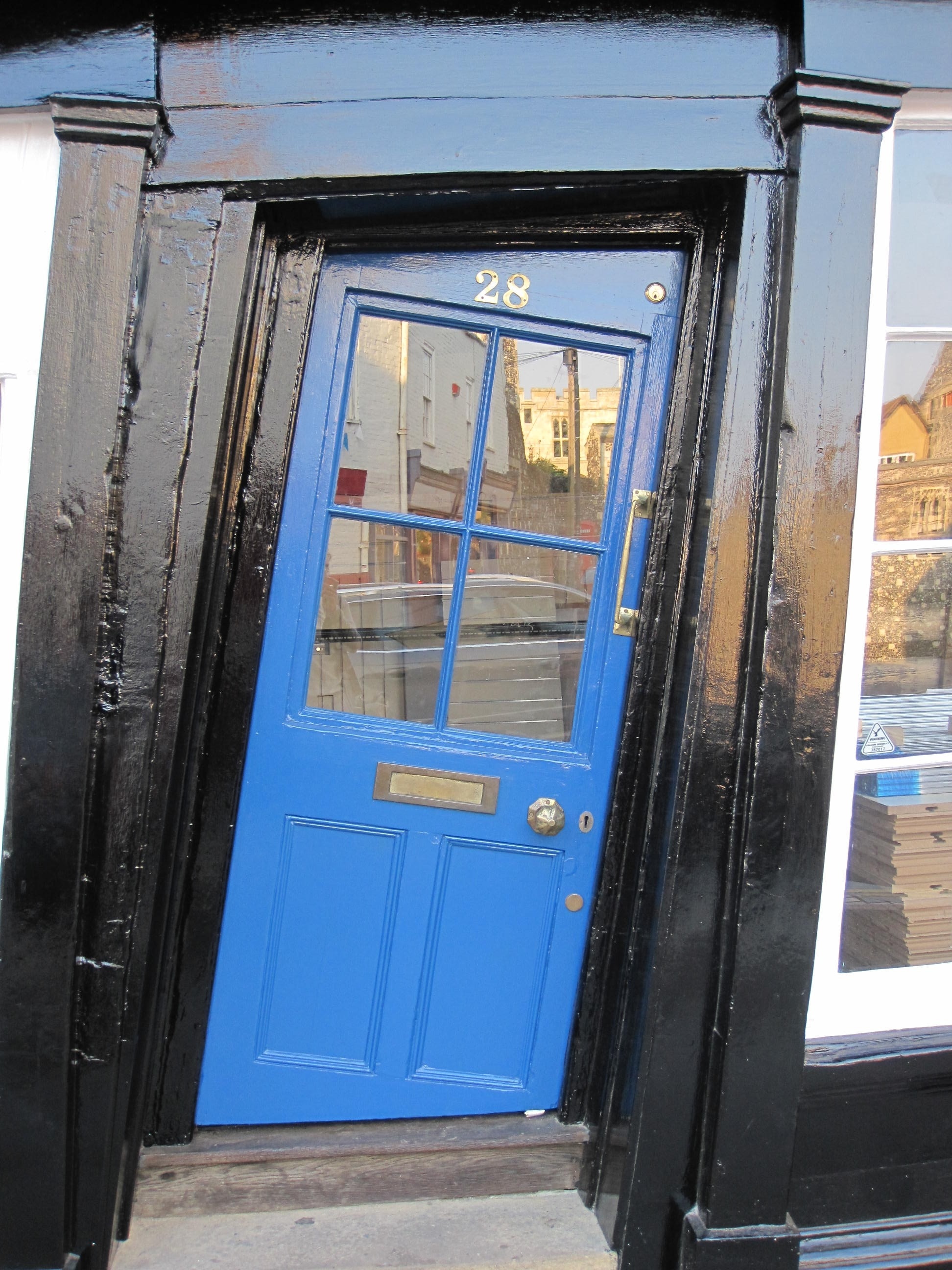 blue wooden half frame glass door closed
