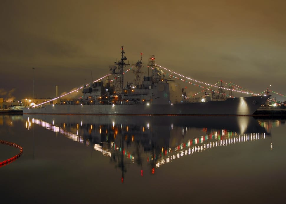 gray lighted ship on water during nighttime preview