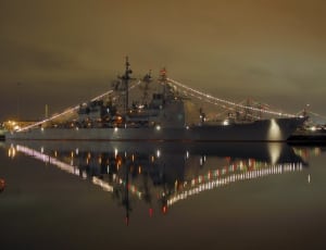 gray lighted ship on water during nighttime thumbnail
