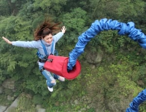 woman jumping with red and blue harness thumbnail