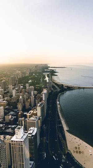 aerial photography of city across body of water thumbnail