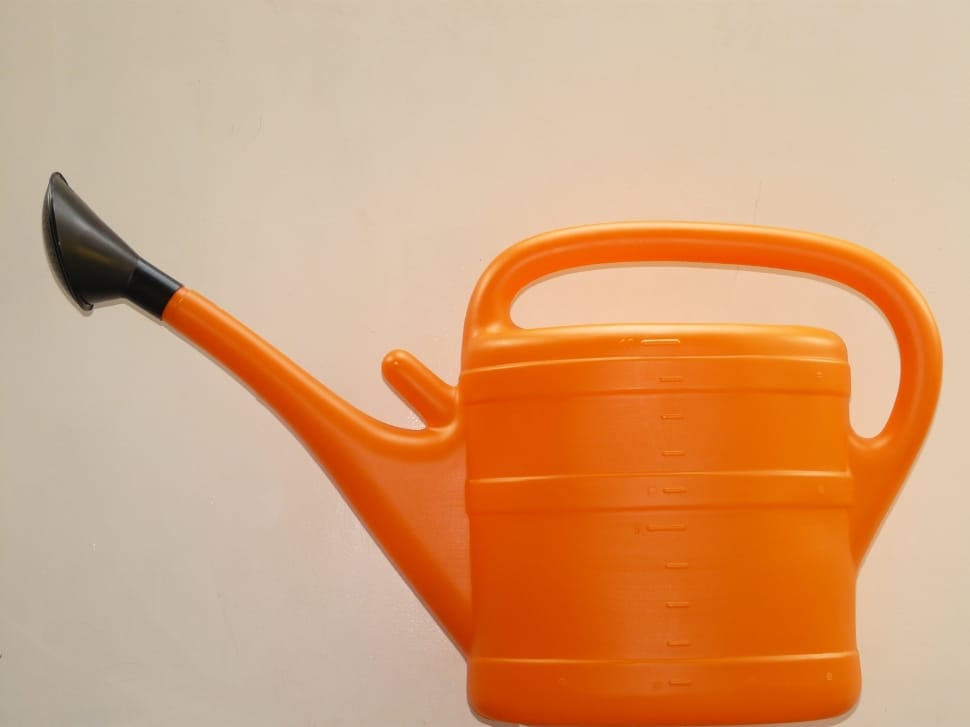 orange and black plastic watering can preview