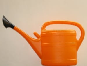 orange and black plastic watering can thumbnail