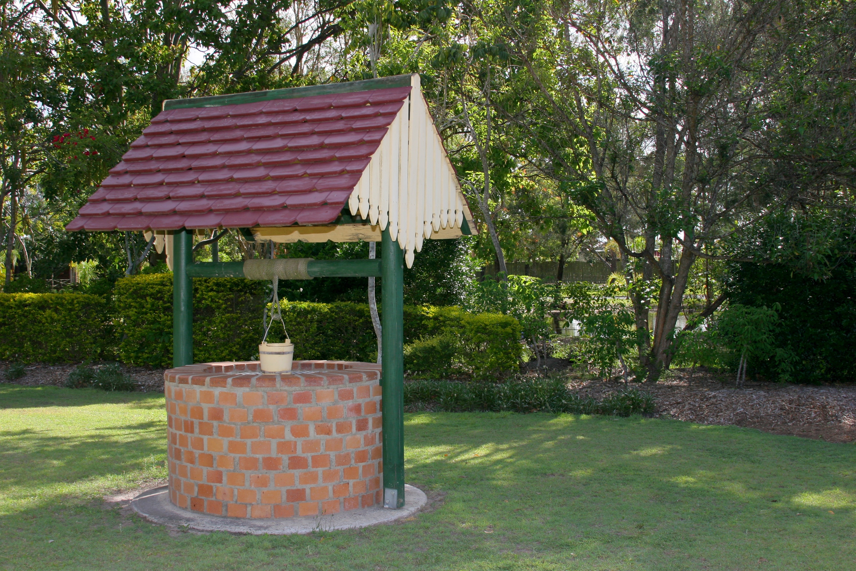 green and brown brick design water well