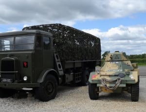 black camouflage truck and battle tank thumbnail