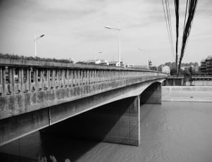 greyscale photo of bridge during daytime thumbnail