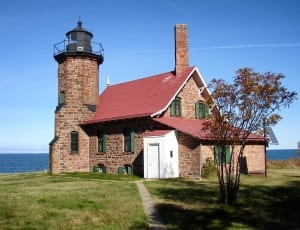 brown cinder brick house with lighthouse thumbnail