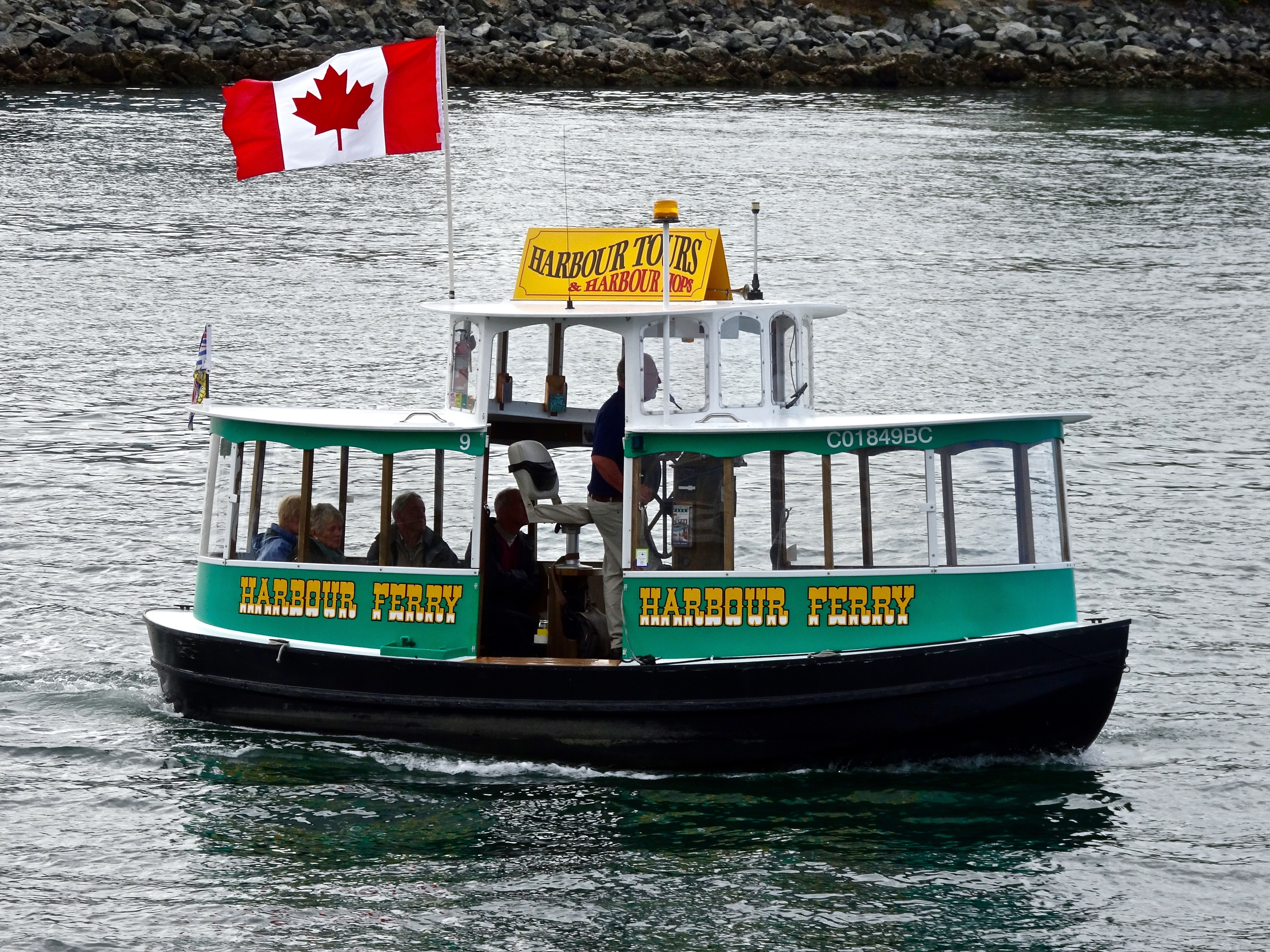green and black canada flag boat