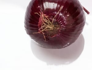 red onion on white table thumbnail