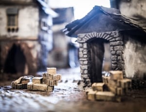 gray and brown miniature buildings table decor thumbnail