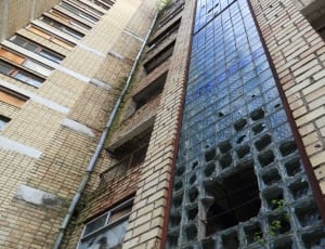 brown bricked high rise building thumbnail
