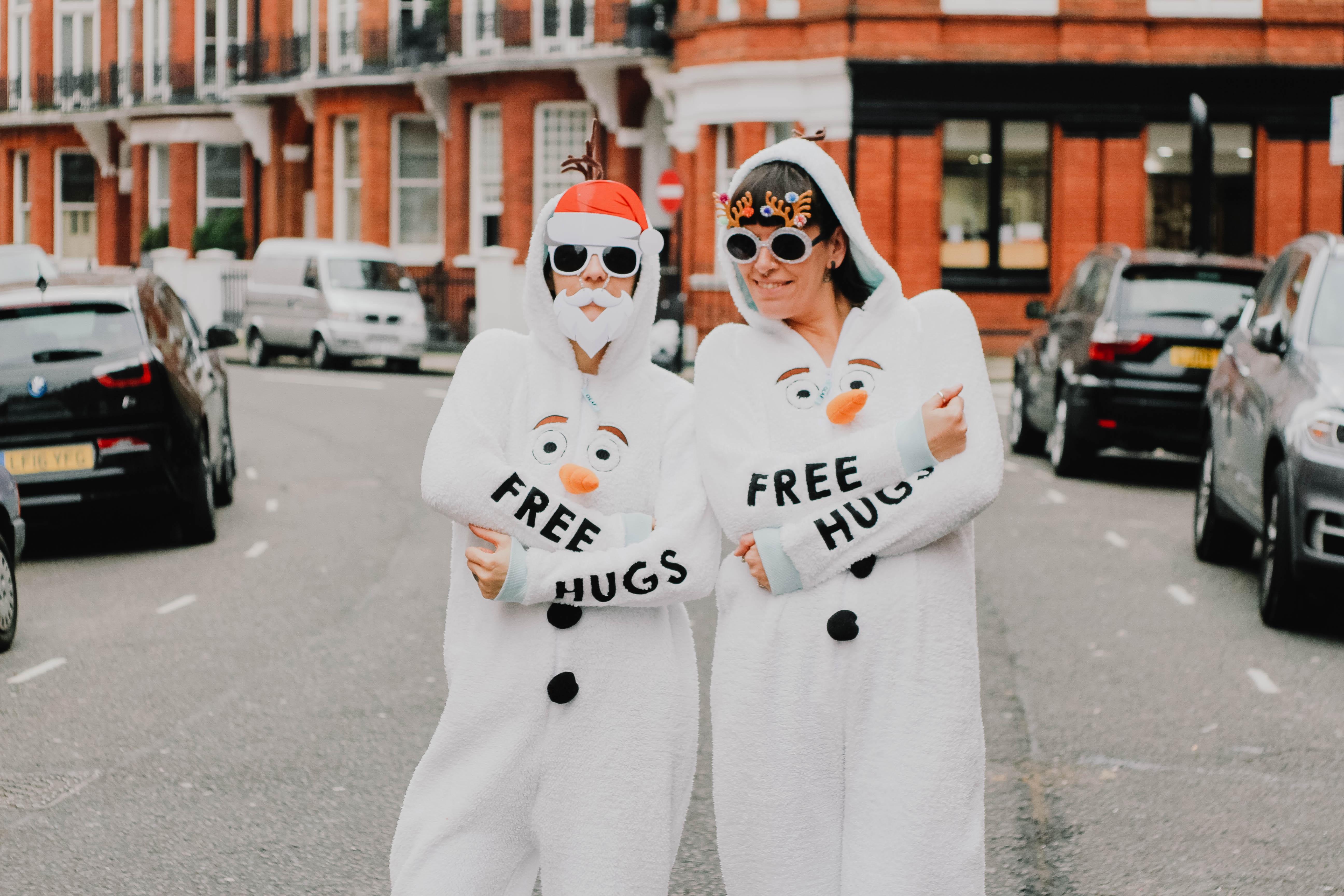 two person wearing white overalls