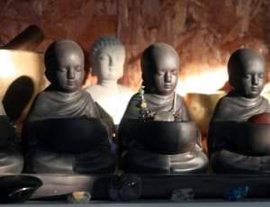 brown buddha figurines thumbnail