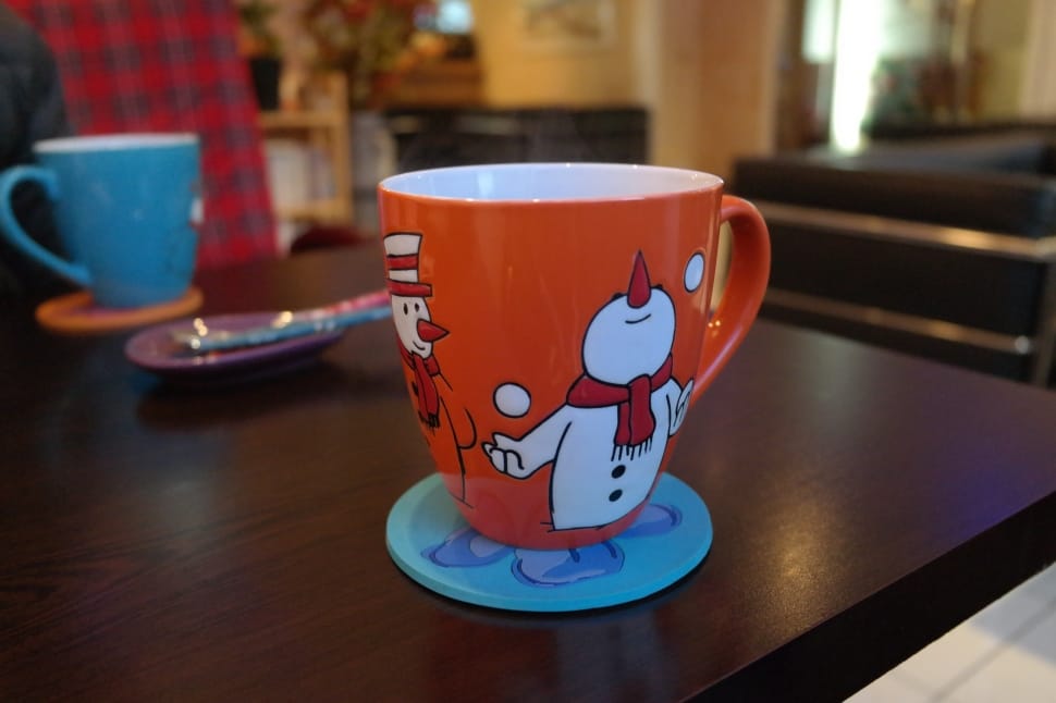 white and orange snowman printed ceramic mug preview