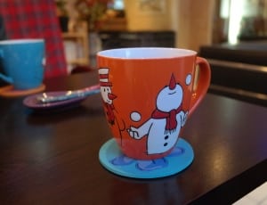 white and orange snowman printed ceramic mug thumbnail