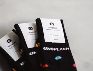 three paired of black  unplash socks thumbnail