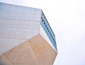 low angle photography of white painted building thumbnail