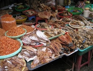 assorted dried fishes on plastic containers thumbnail