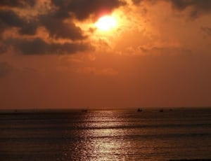 body of water and sun set photography thumbnail