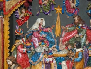 red blue and yellow multicolored the nativity figurine thumbnail