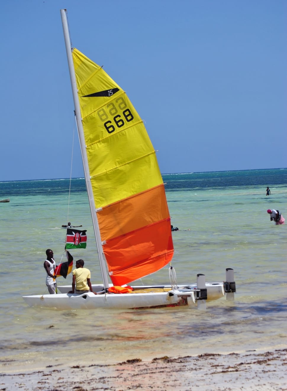 yellow orange and white sailboat preview