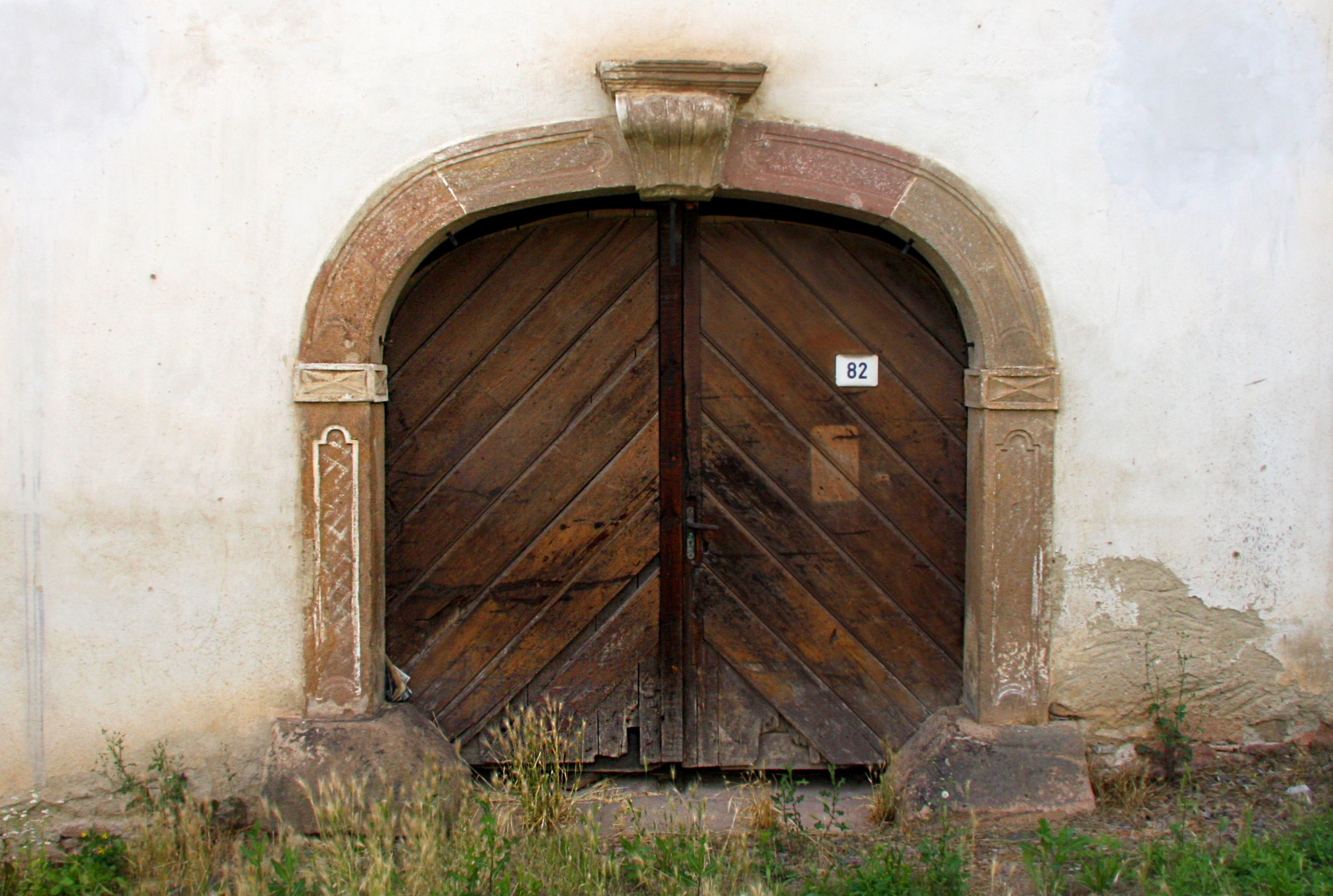 brown wooden arc door