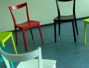 green red and black wooden chairs thumbnail