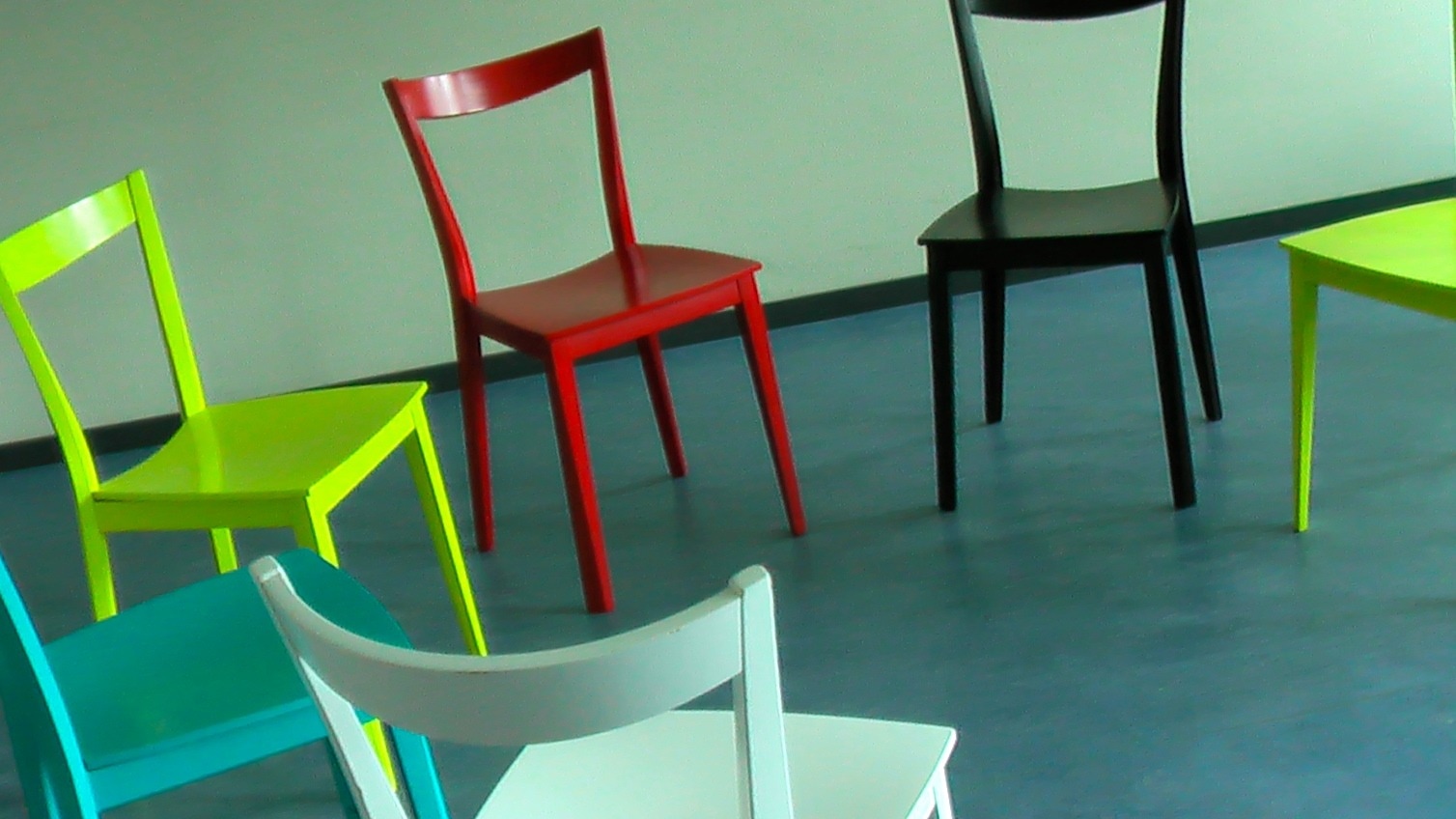 green red and black wooden chairs
