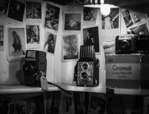 grayscale photo of vintage cameras thumbnail