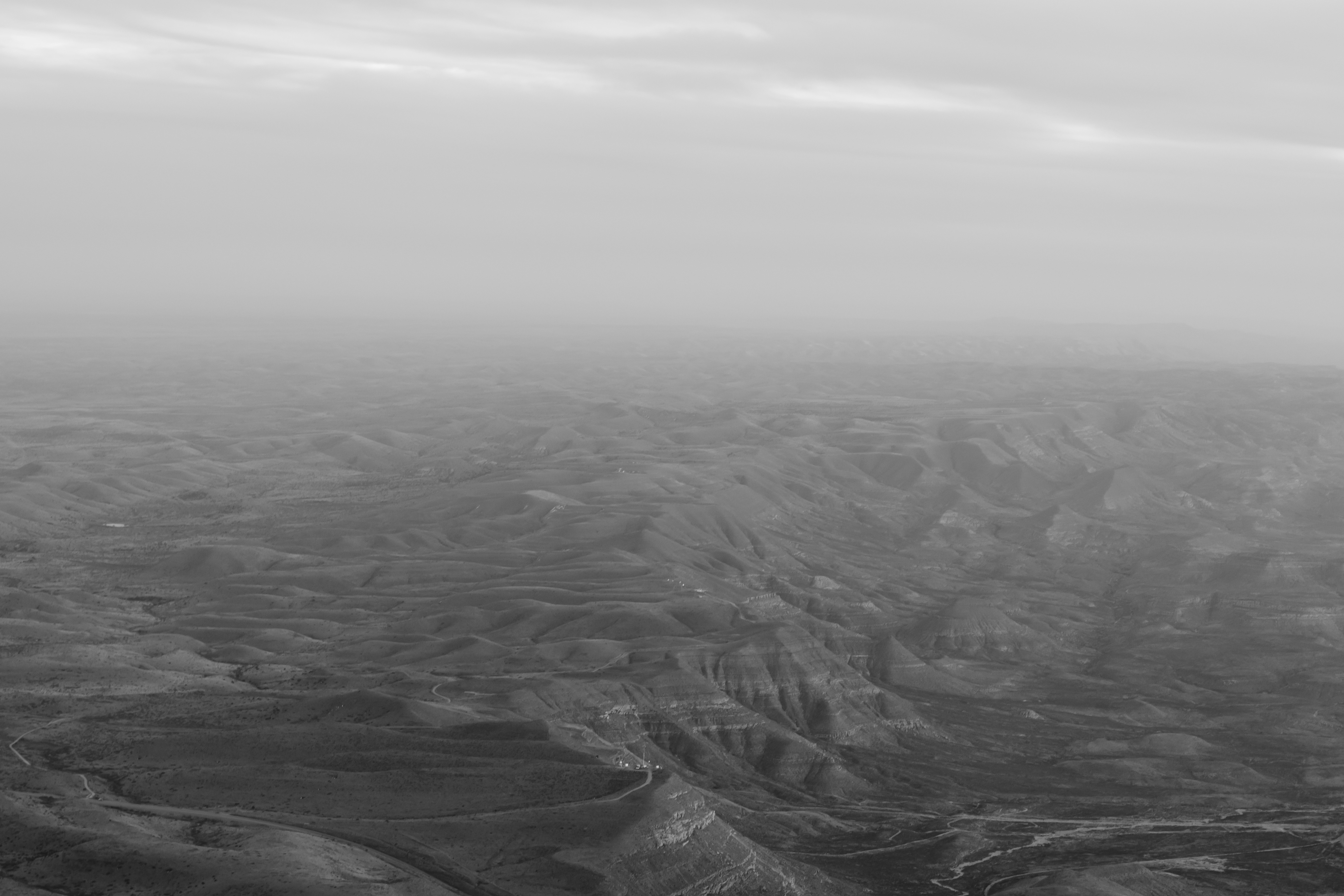 greyscale photo of land formation