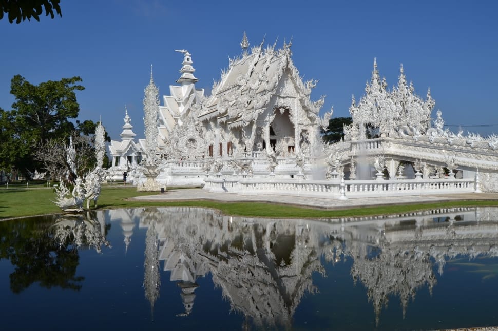 white temple near pond preview