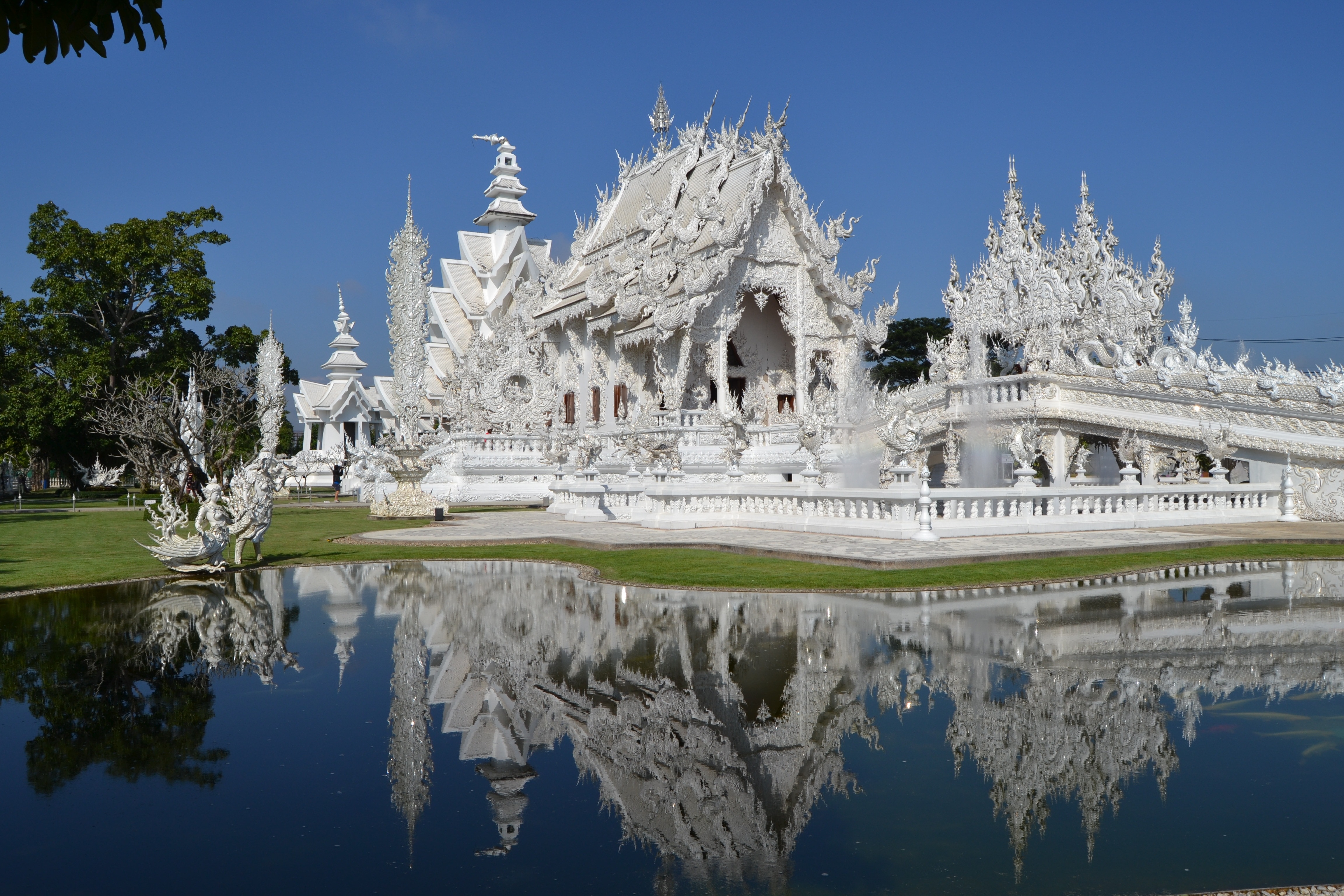 white temple near pond
