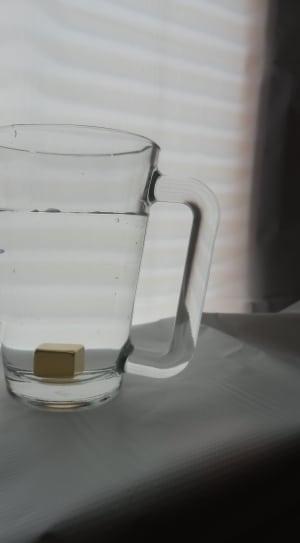 cube in clear glass drinking mug thumbnail
