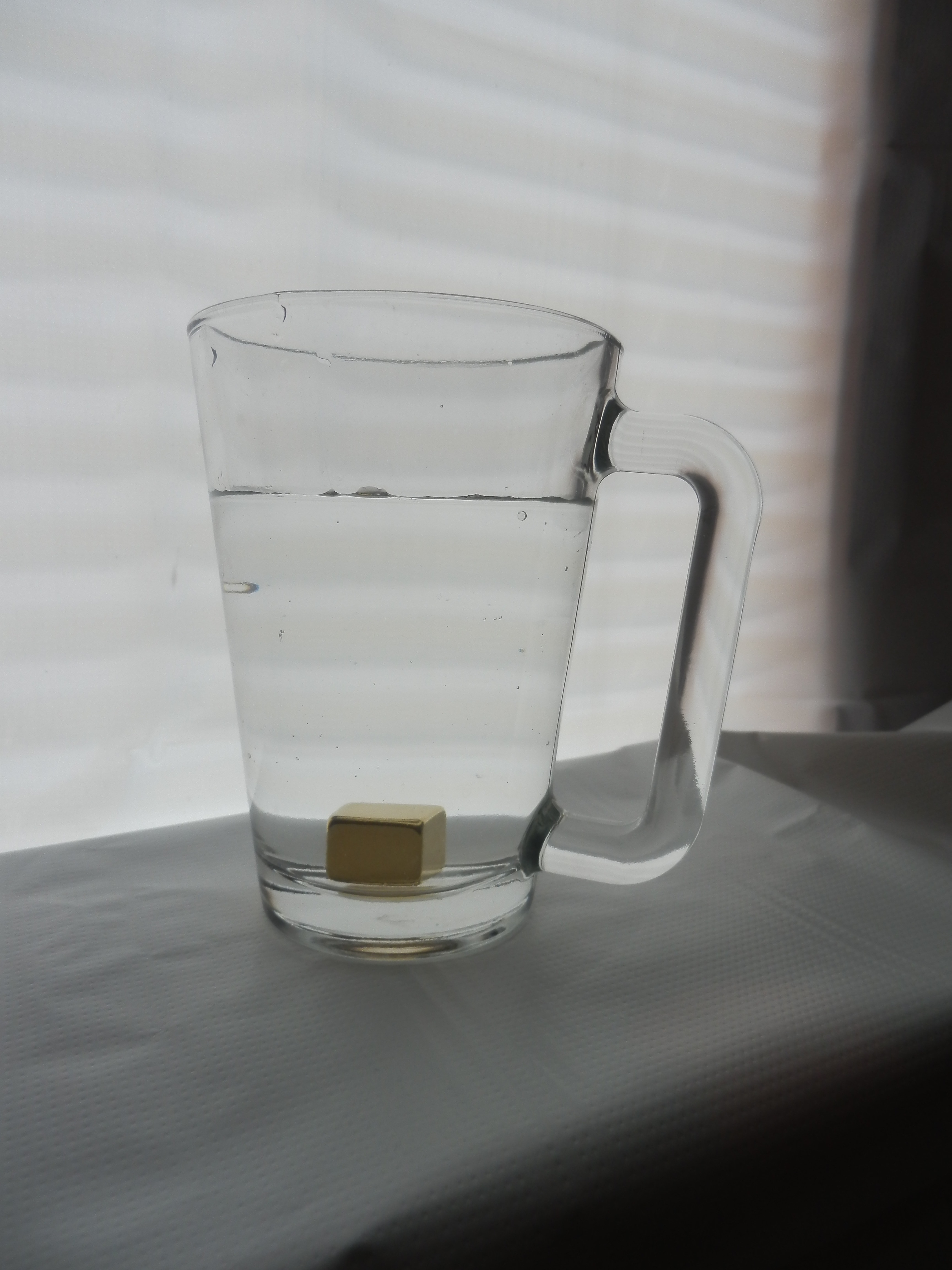 cube in clear glass drinking mug